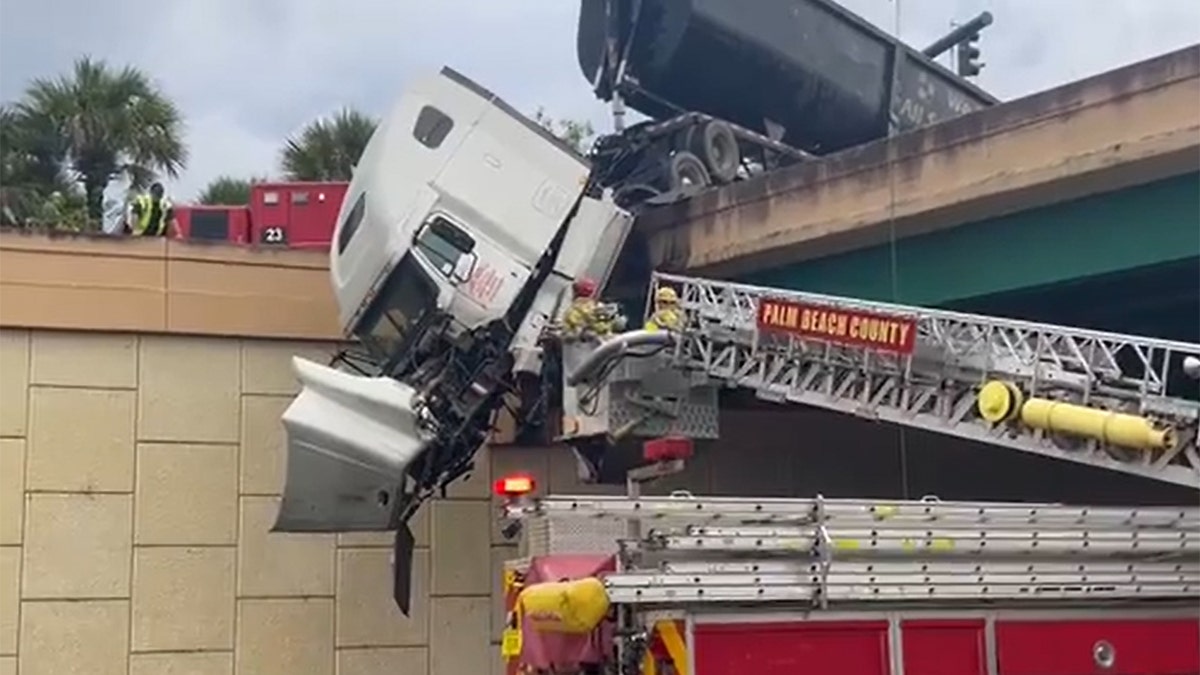 Driver rescued from truck cap suspended over bridge in Florida