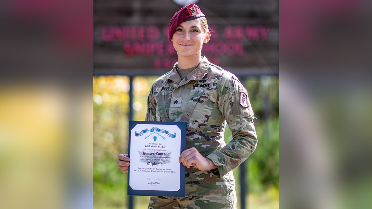 Sgt. Maciel Hay posing graduation certificate