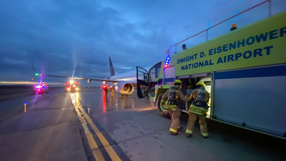 Firefighters seen near plane