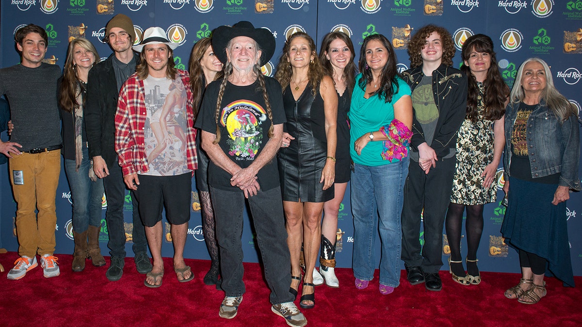 Willie Nelson with many of children