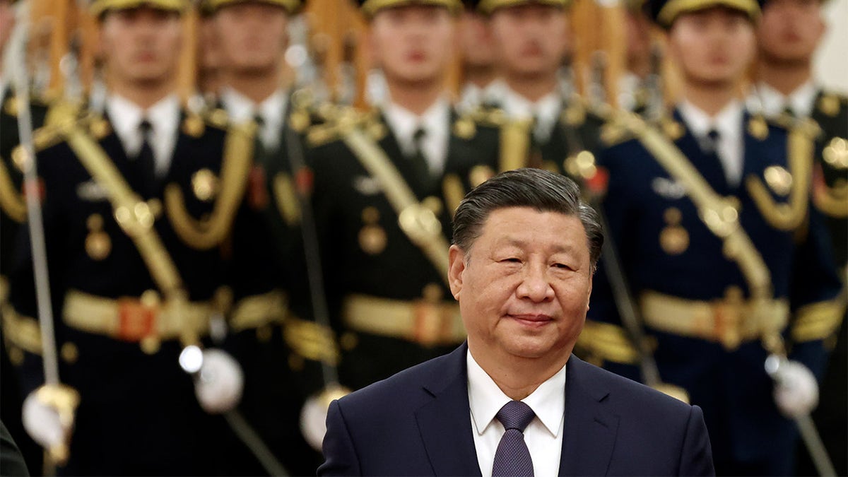  Chinese President Xi Jinping reviews the honour guard during a welcome ceremony at The Great Hall of the People in Beijing, China. 
