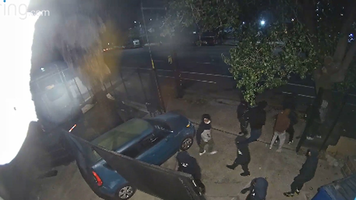 Thieves in hoodies walking, blue stolen car ram into gate