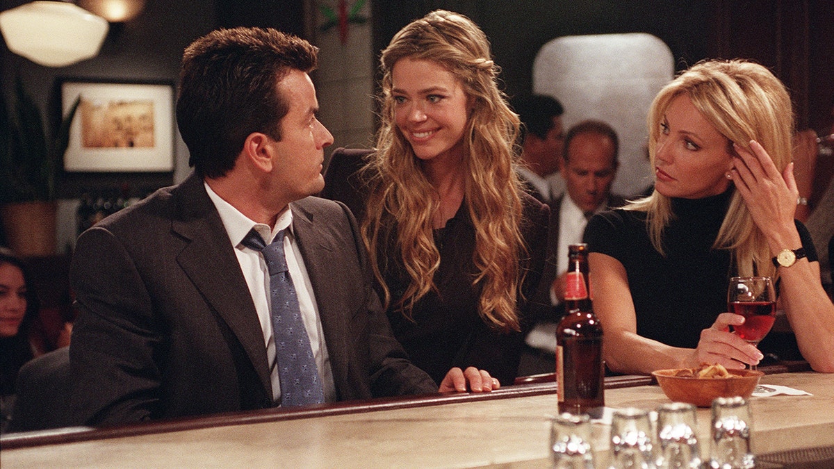 A photo of Charlie Sheen, Denise Richards, Heather Locklear