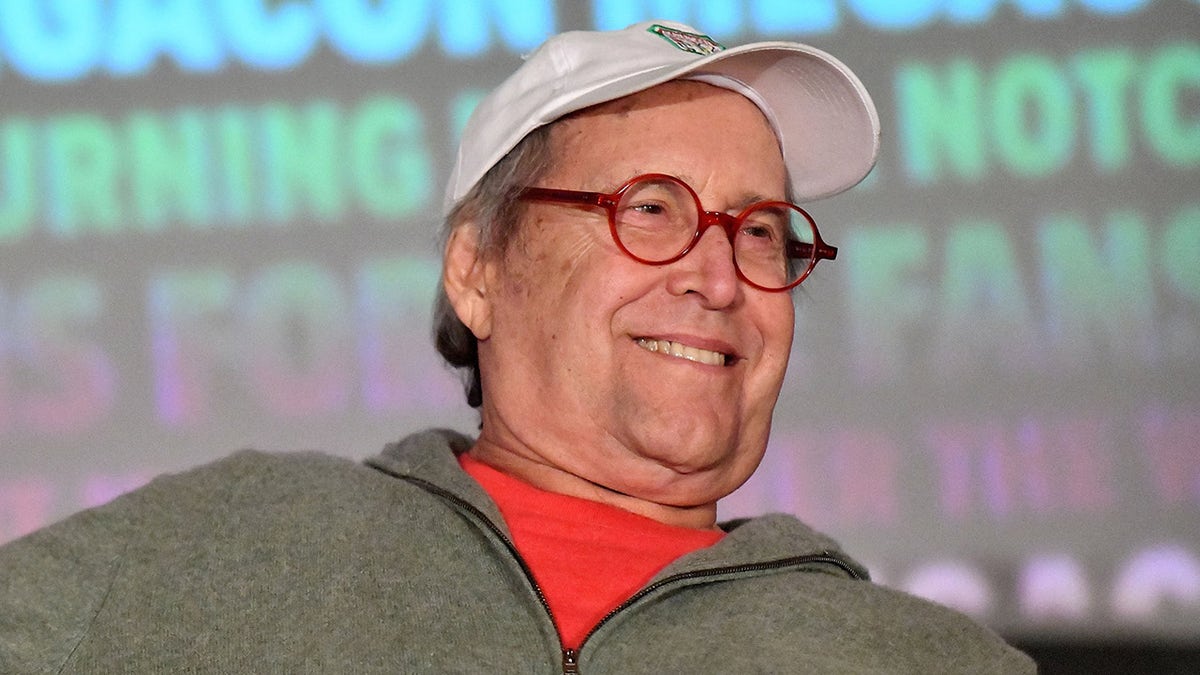 Chevy Chase smiles at National Lampoon's panel