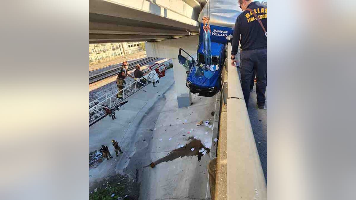 truck hanging off bridge