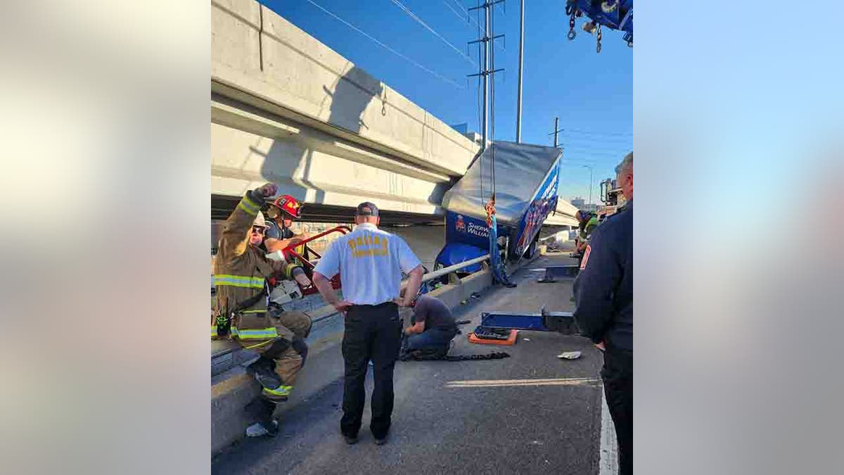 truck hanging off bridge