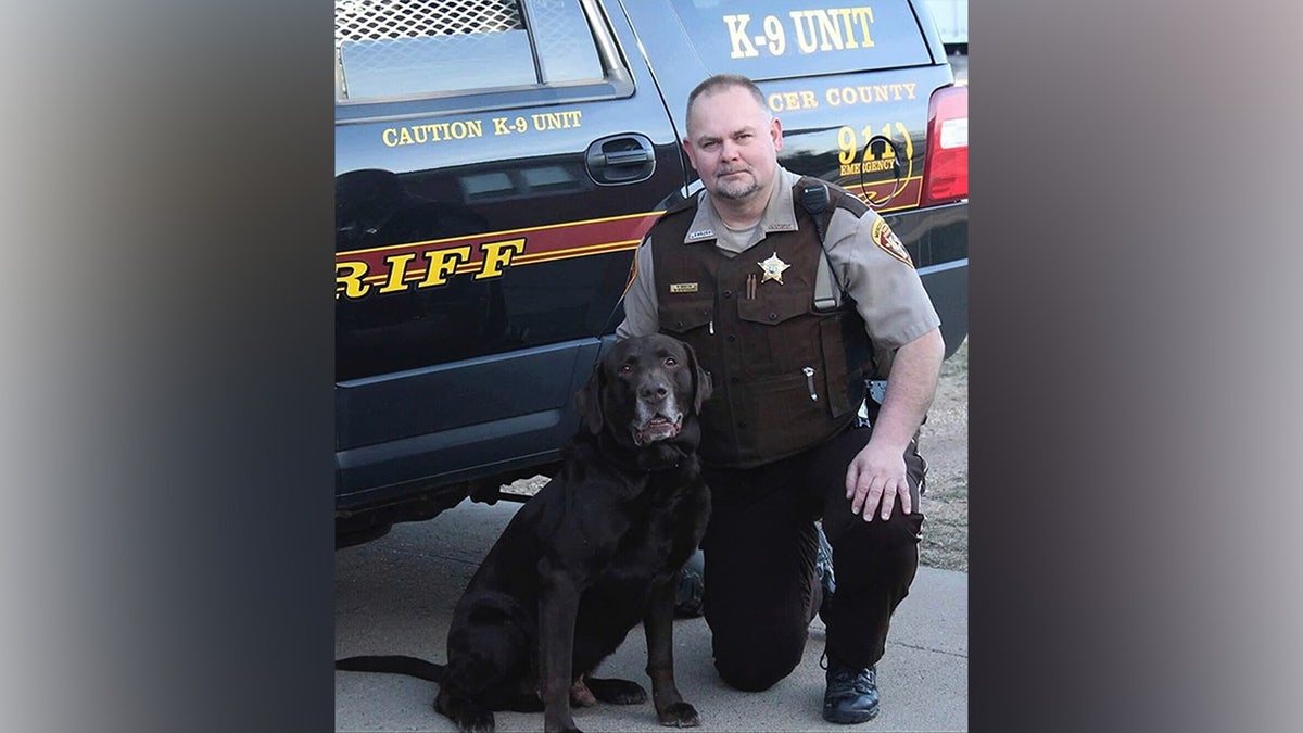 Sheriff's Deputy Paul Martin with his retired K9 Goliath