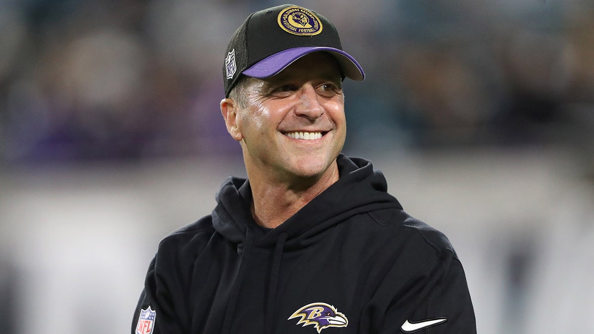 John Harbaugh reacts to fans' cheers