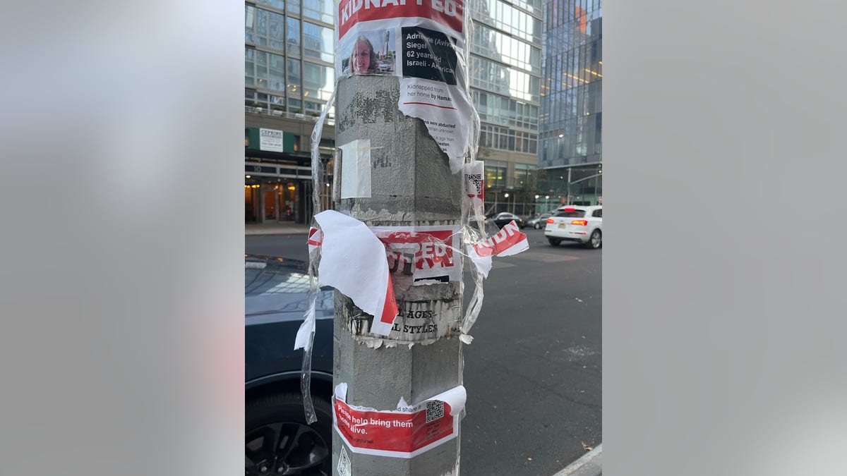 Ripped posters of Israel kidnappings
