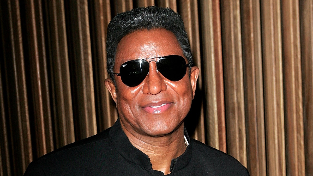 Jermaine Jackson wears sunglasses indoors