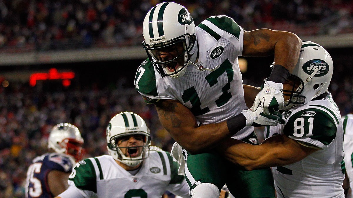 Jets players celebrate a divisional round win