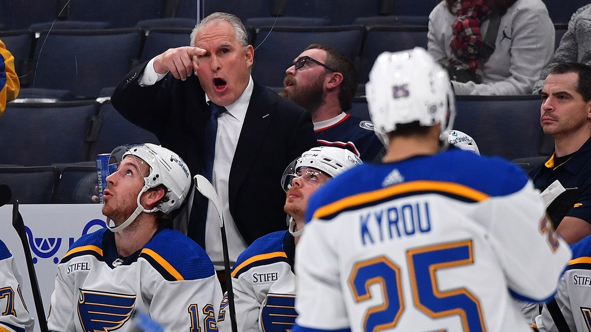 Craig Berube directs Jordan Kyrou on the ice