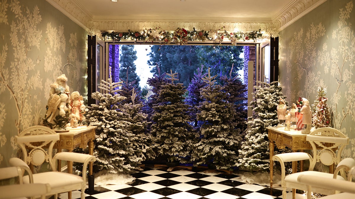 Kathy Hilton living room full of flocked Christmas trees