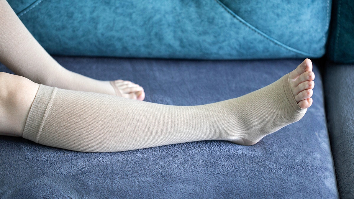 woman wearing long compression socks