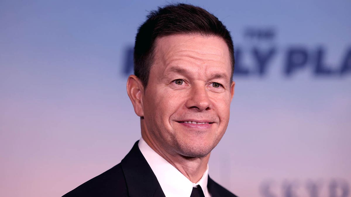 mark wahlberg smiling in close-up at the family plan premiere