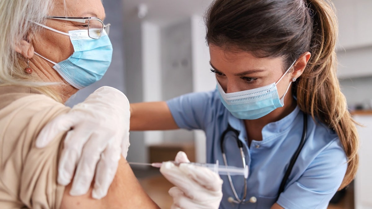 Nurse giving vaccine