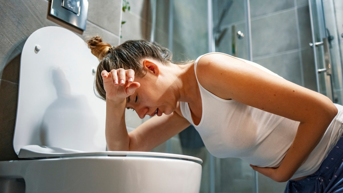 Pregnant woman vomiting