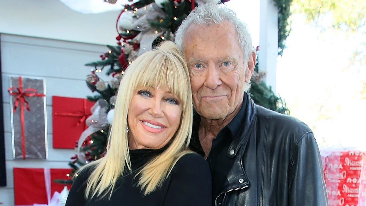 Suzanne Somers cuddles up to husband Alan Hamel at Christmas themed event