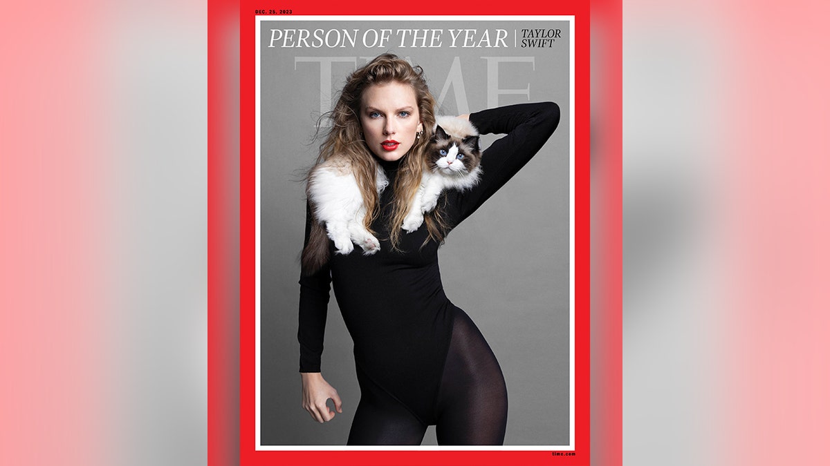 Taylor Swift poses with her cat Benjamin on the cover of TIME.