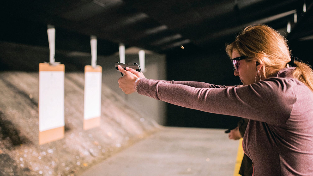 Beth Alcaraz shooting gun
