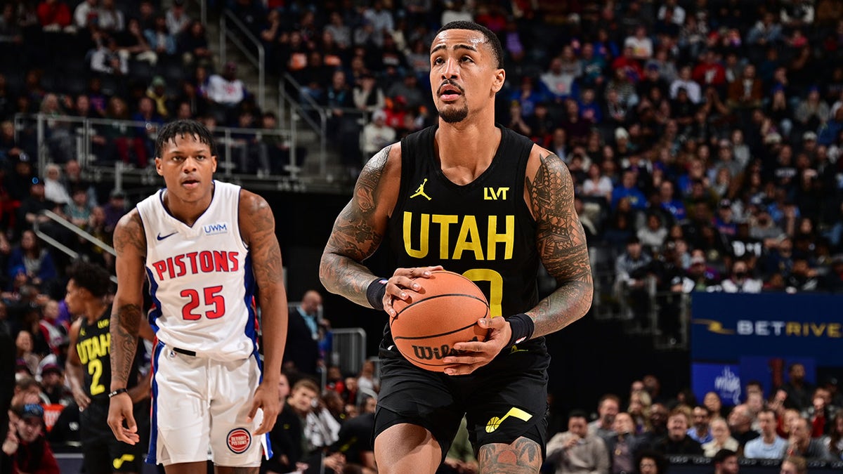 John Collins shoots a free throw