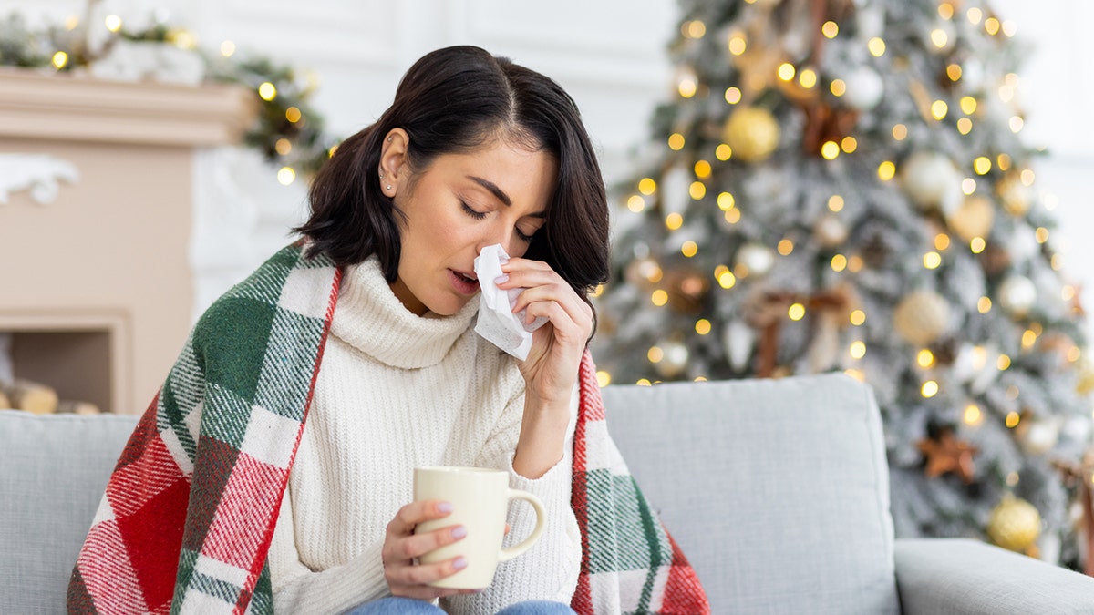 woman sick from Christmas tree