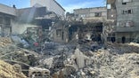 A view of destroyed roads and Kamal Adwan Hospital