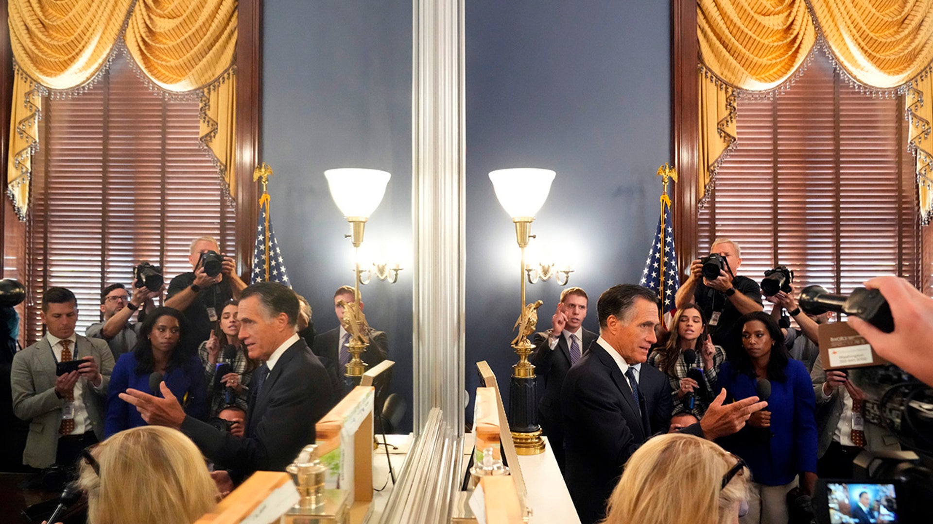 Senator Mitt Romney speaks to the press