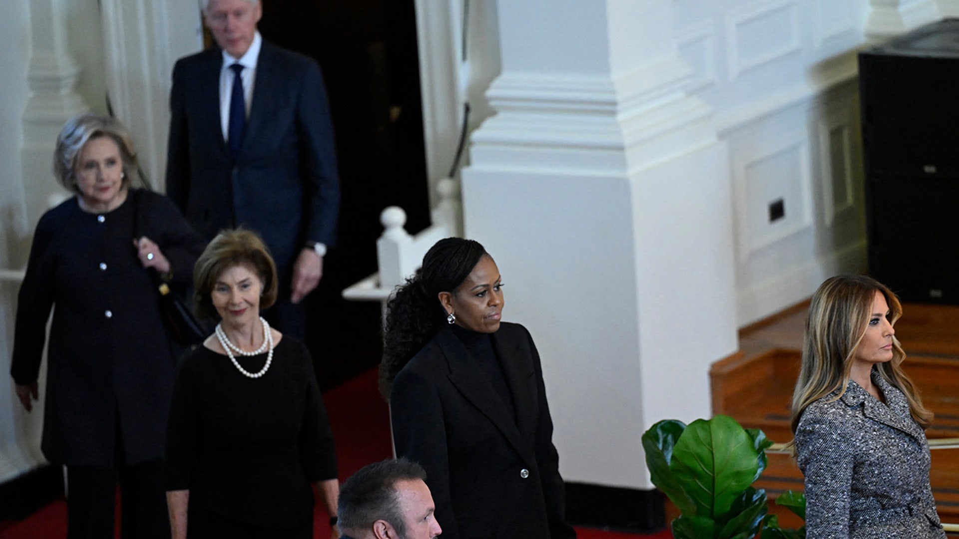 Melania Trump, Michelle Obama, Laura Bush and Hillary Clinton arrive at Rosalynn Carter's funeral.
