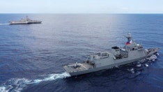 US Navy responds after China claims American warship 'illegally intruded' into the South China Sea