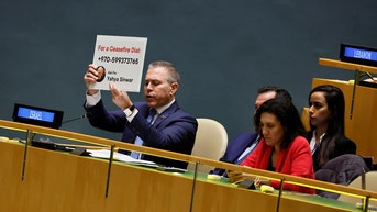 Israeli UN ambassador holds up sign with Hamas leader's number in vote on cease-fire