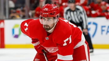 Red Wings' Dylan Larkin lay motionless after taking hit to head, helped off ice following scary scene