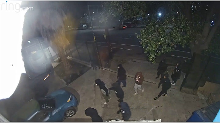 Surveillance video shows burglars crash stolen car through security gate in $100K heist