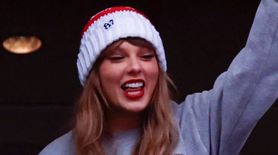 Taylor Swift cheers as she watches boyfriend Travis Kelce play football 