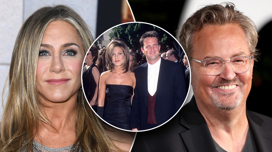 Matthew Perry looks proud of his new book as he holds it up after  dishing on Jennifer Aniston