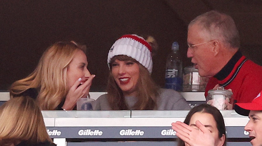 Taylor Swift cheers as she watches boyfriend Travis Kelce play football 