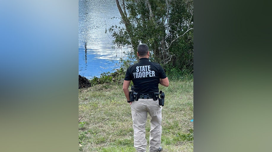Police on scene of van in pond near Walt Disney World