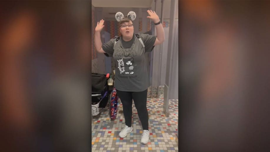 Woman throws up arms following alleged racist comments