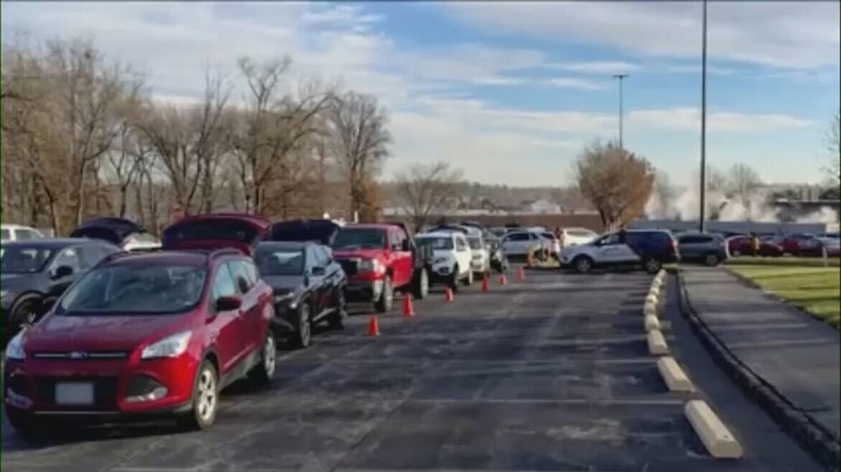 cars are lined up at a Missouri food giveaway
