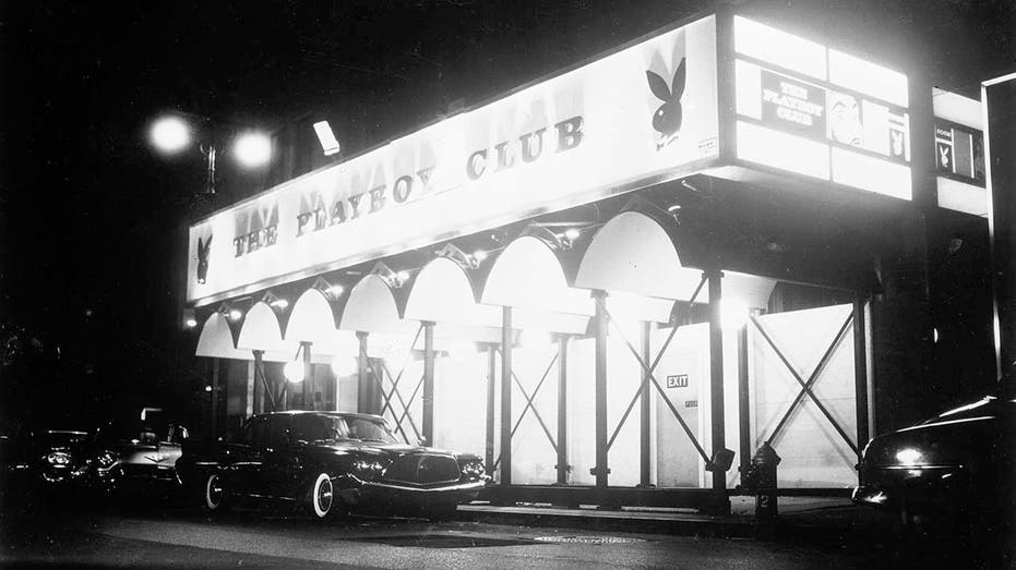 black and white photo of The Playboy Club marquee seen from street