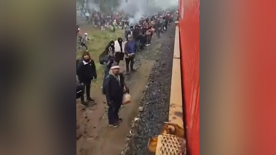 Thousands of migrants wait a few hours from Eagle Pass, Texas, to catch trains headed for southern border