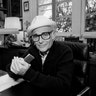 Norman Lear sits at a desk