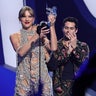 Taylor Swift accepts an award onstage at the 2022 MTV VMAs