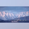 The Hollywood sign stands in front of snow-covered mountains