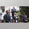 oe Biden speaks while children dressed as Secret Service agents "guard" the stage on Take Your Child To Work Day