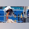 Debris from the Titan submersible is unloaded