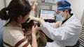 Dr. Yilai Shu examines a young patient at the Eye &amp; ENT Hospital of Fudan University in Shanghai, China, after a gene therapy procedure for hereditary deafness. A small study published Wednesday, Jan. 25, 2024, in the journal Lancet, documents significantly restored hearing in five of six kids treated in China.