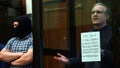 Paul Whelan stands inside a defendants' cage as he waits to hear his verdict in Moscow on June 15, 2020.