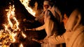 Iranian Zoroastrian youth set fire to a prepared pile of wood in a ceremony celebrating their ancient mid-winter Sadeh festival in the outskirts of Tehran, Iran, Tuesday, Jan. 30, 2024. Hundreds of Zoroastrian minorities gathered after sunset to mark their ancient feast, creation of fire, dating back to Iran's pre-Islamic past.