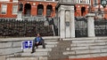Boston, MA - January 25: Joe Barrett, a Special Education Support Staff member with Newton Public Schools, sat on the steps of the Massachusetts State House alone after demonstrating with about 200 other members of the NTA. (Photo by David L. Ryan/The Boston Globe via Getty Images)